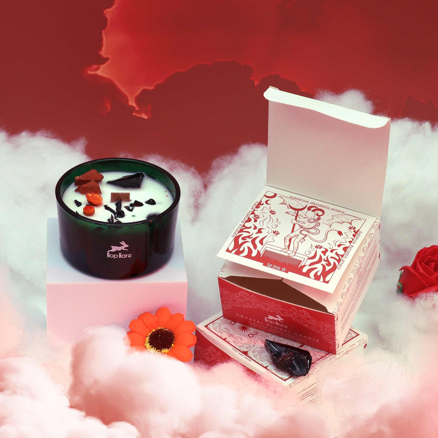 Hop Hare The Devil crystal candle with red jasper, black agate, dried flowers, and tarot card in dark green jar