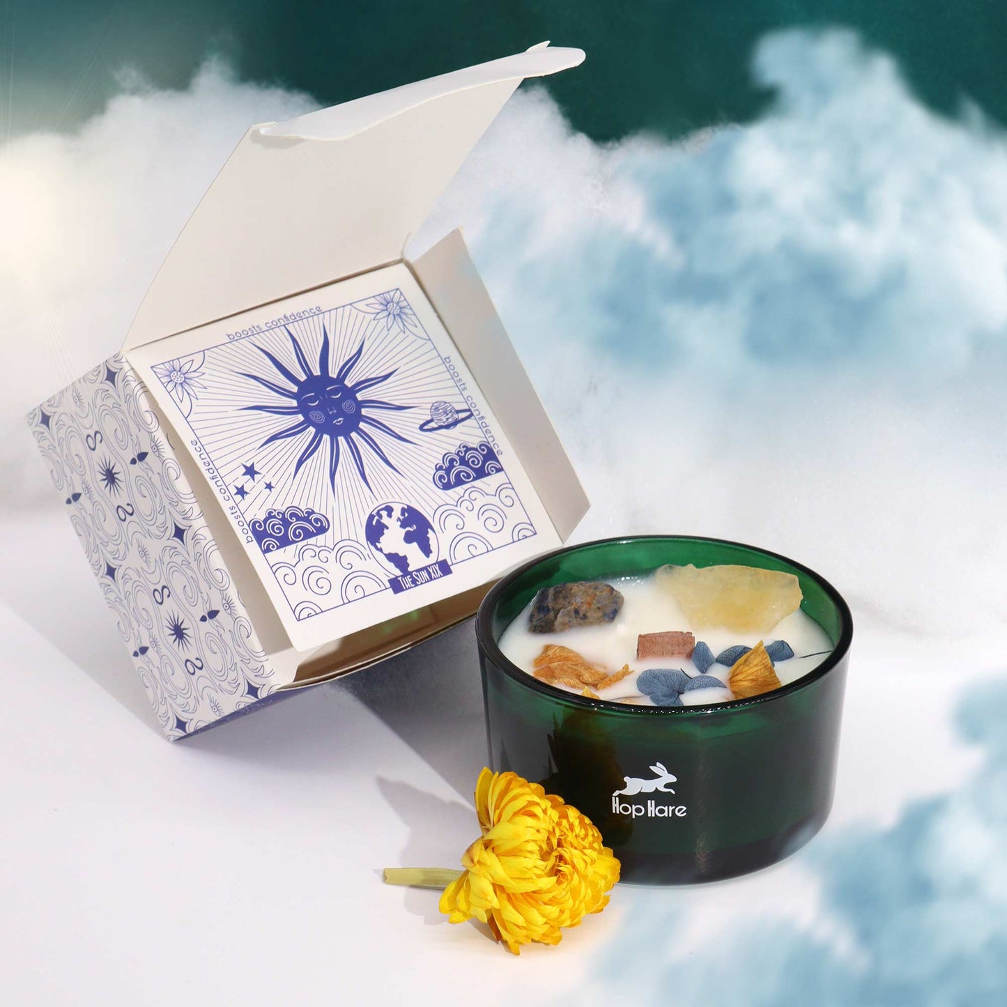 Hop Hare The Sun crystal candle with citrine, sodalite, dried flowers, and tarot card in dark green jar