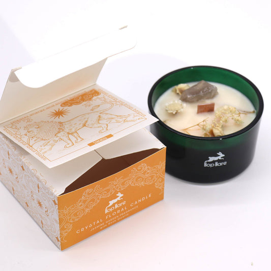 Hop Hare The Lion crystal candle with rock quartz, dried flowers, and tarot card in dark green jar