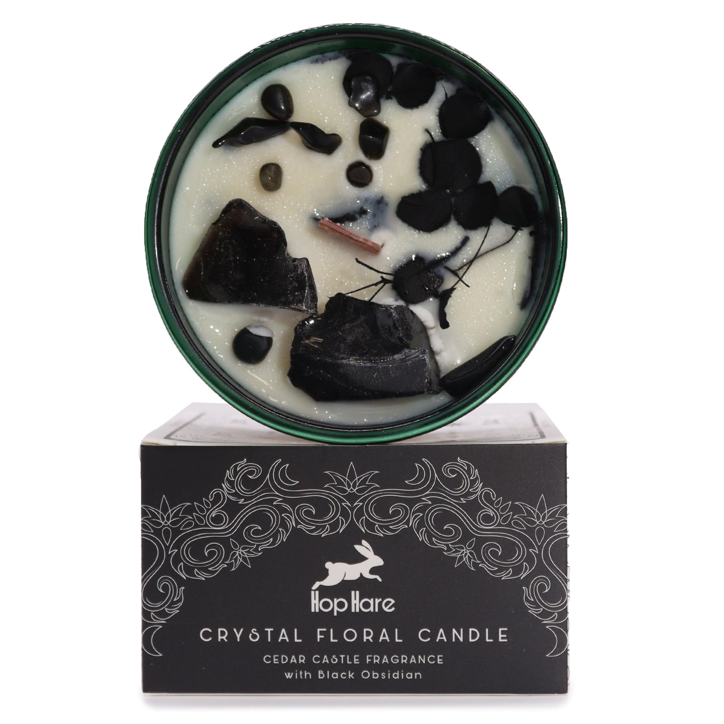 Hop Hare Knight of Swords crystal candle with black obsidian, dried flowers, and tarot card in dark green jar