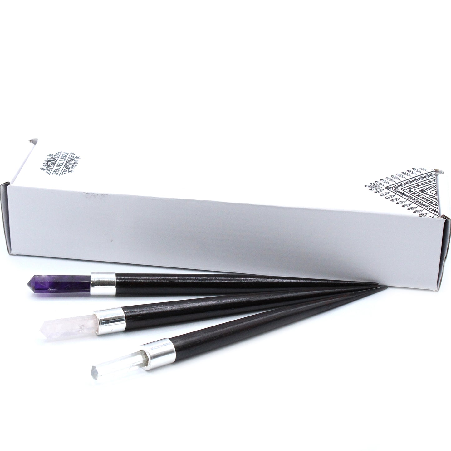 Set of 3 healing wands with pointed crystal tips: amethyst, rose quartz, and rock quartz. Featuring wooden handles and silver caps for energy work and meditation.