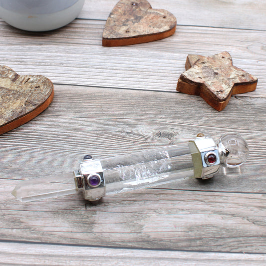 Hexagonal rock quartz healing wand with pointed tip, rounded sphere end, and gemstone accents. Ideal for energy amplification, clarity, and chakra work.