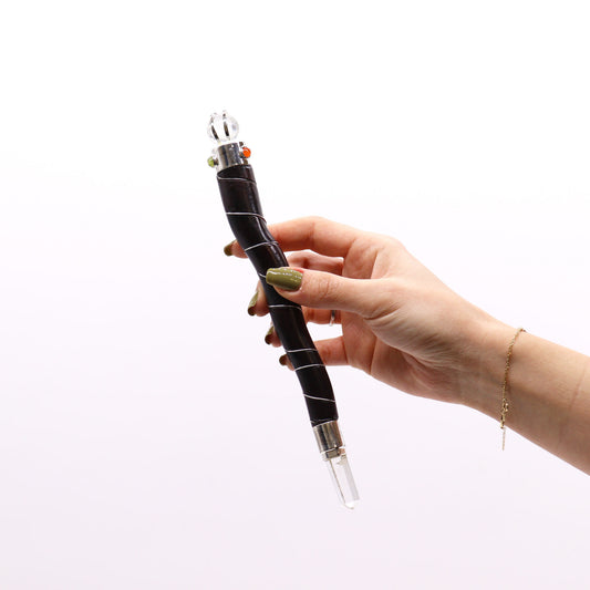 Curved wood and rock quartz healing wand with gemstones and silver wire wrapping. Handmade in India for energy healing, reiki, and spiritual alignment.