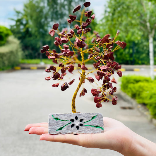 Red jasper crystal tree with carved stone base