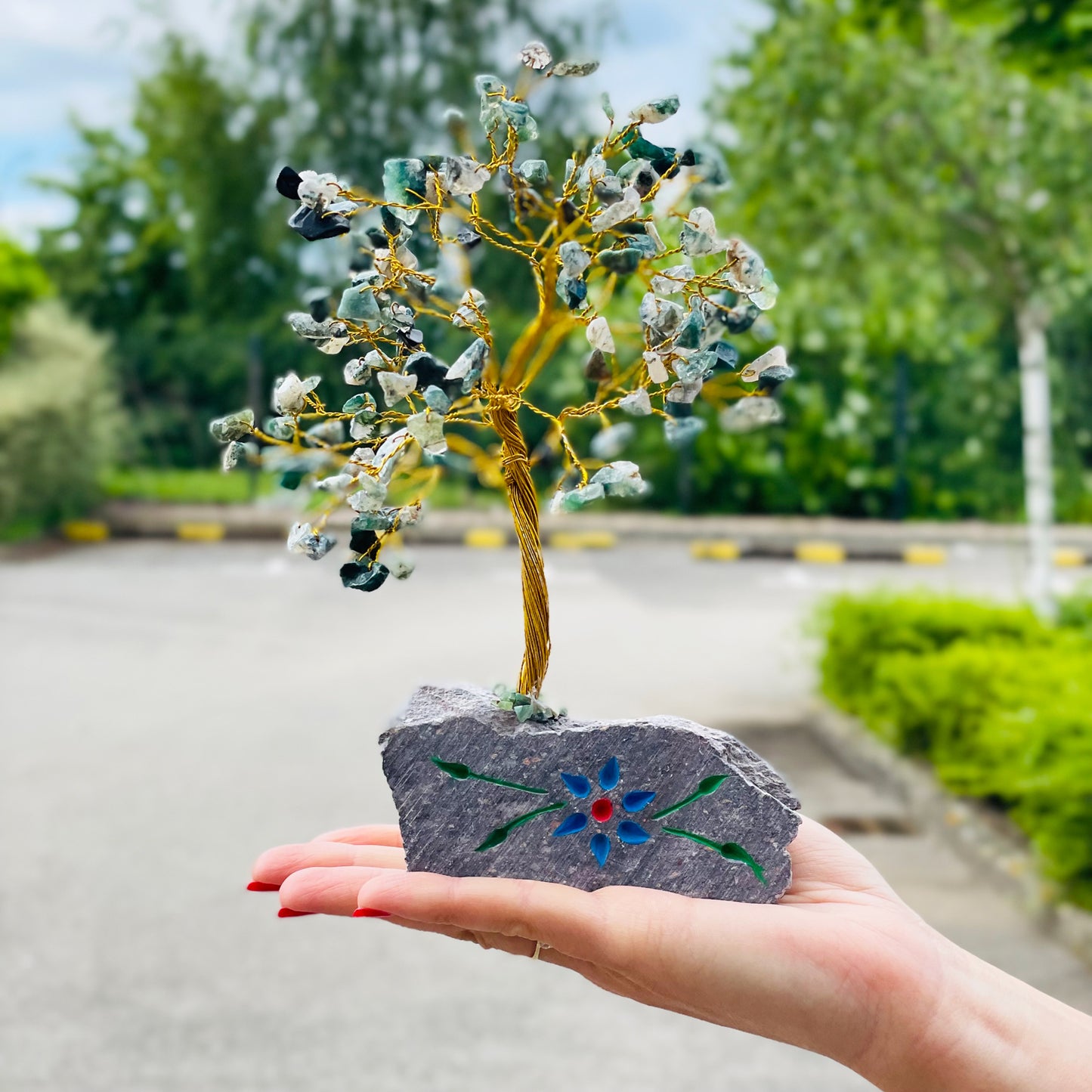Moss agate crystal tree with hand-carved stone base