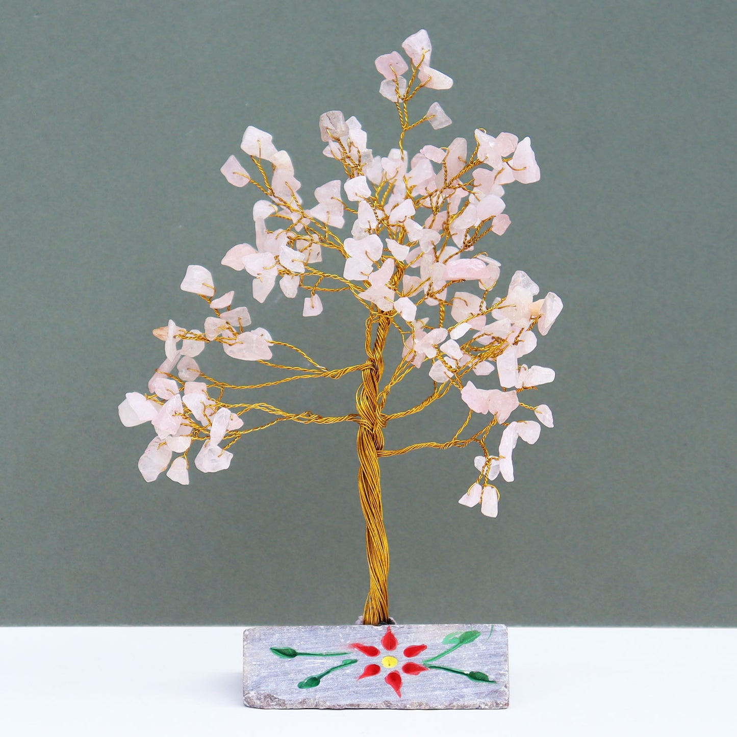 Rose quartz crystal tree with hand-carved base