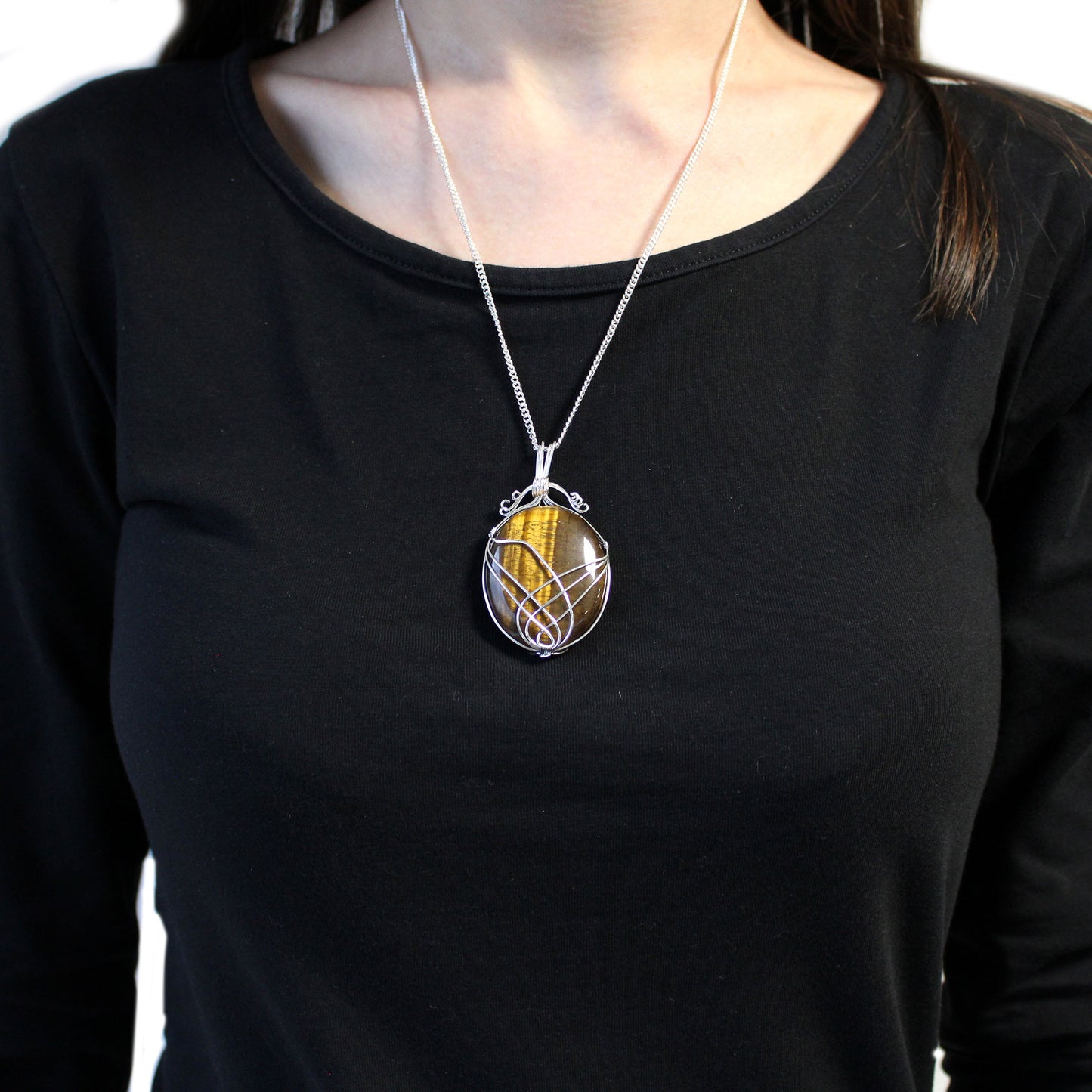 Oval Tiger's Eye gemstone necklace with silver swirl wire wrap on a 50cm silver-plated chain.