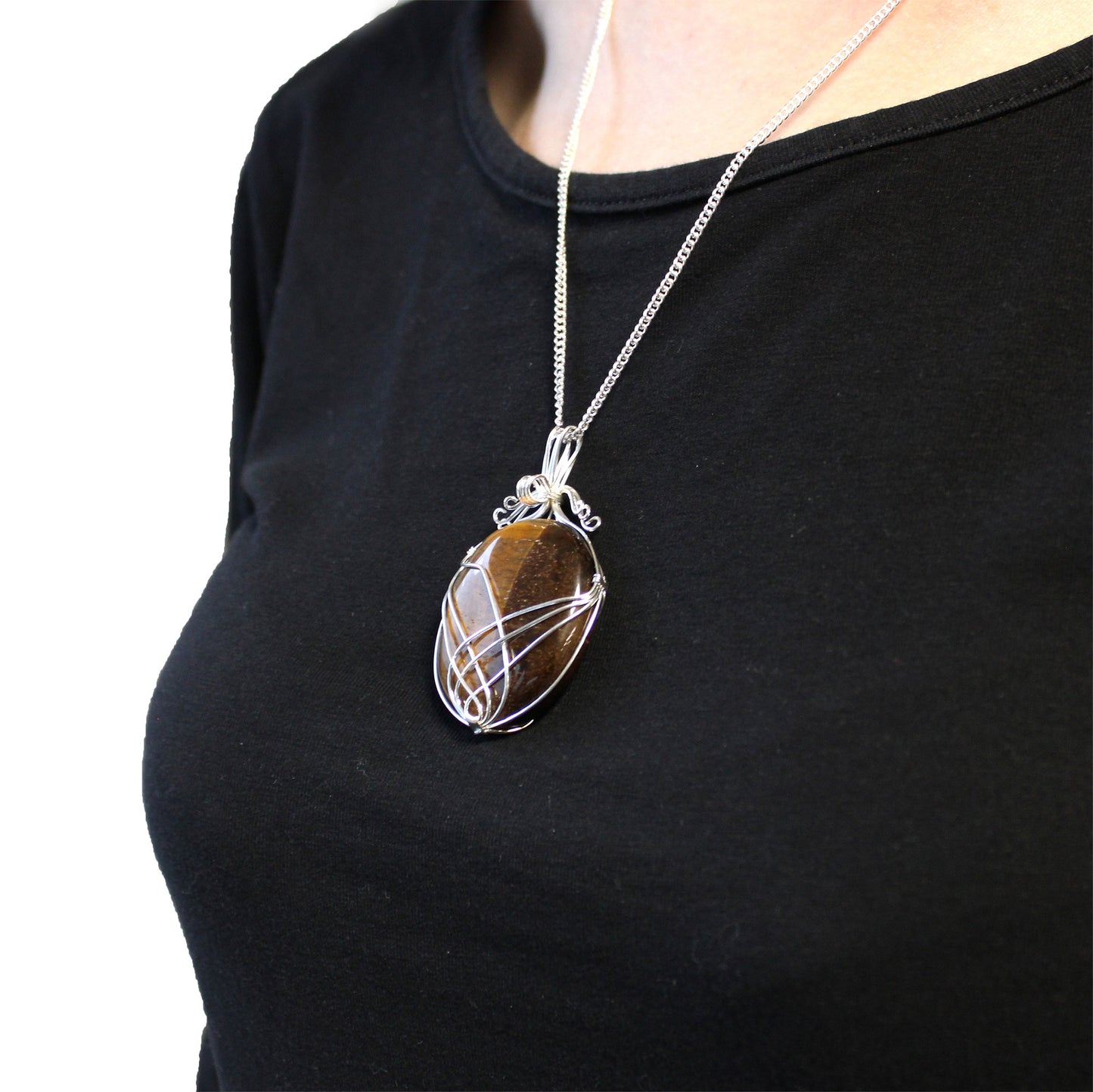 Oval Tiger's Eye gemstone necklace with silver swirl wire wrap on a 50cm silver-plated chain.