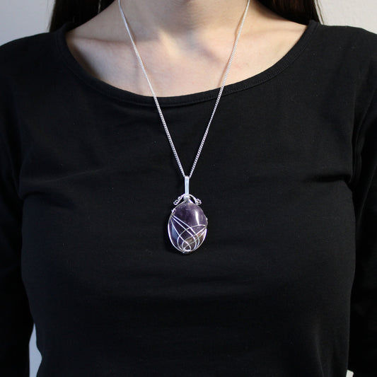 Oval Amethyst gemstone necklace with silver swirl wire wrap on a 50cm silver-plated chain.