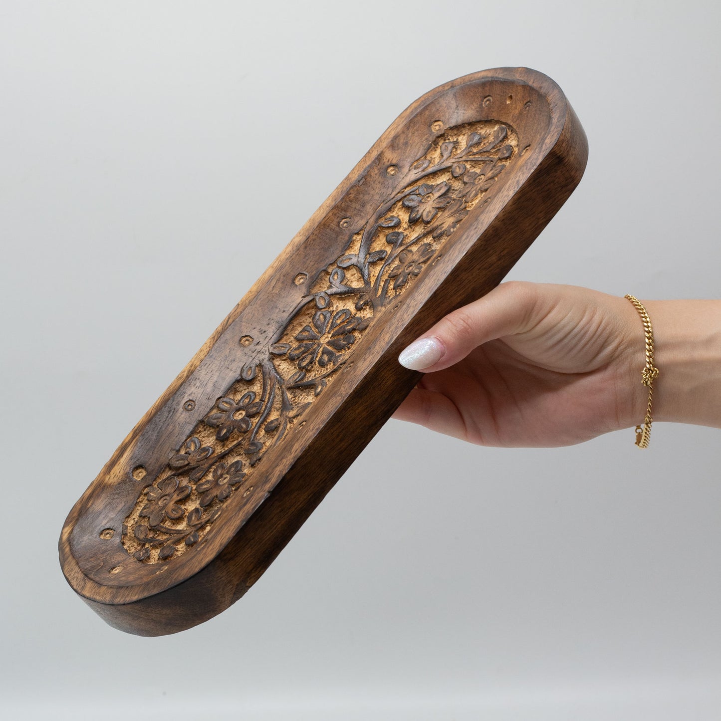 Large mango wood incense tray with intricate hand-carved floral pattern, crafted in Saharanpur, India. 30x10cm with multiple stick holders and ash tray base.