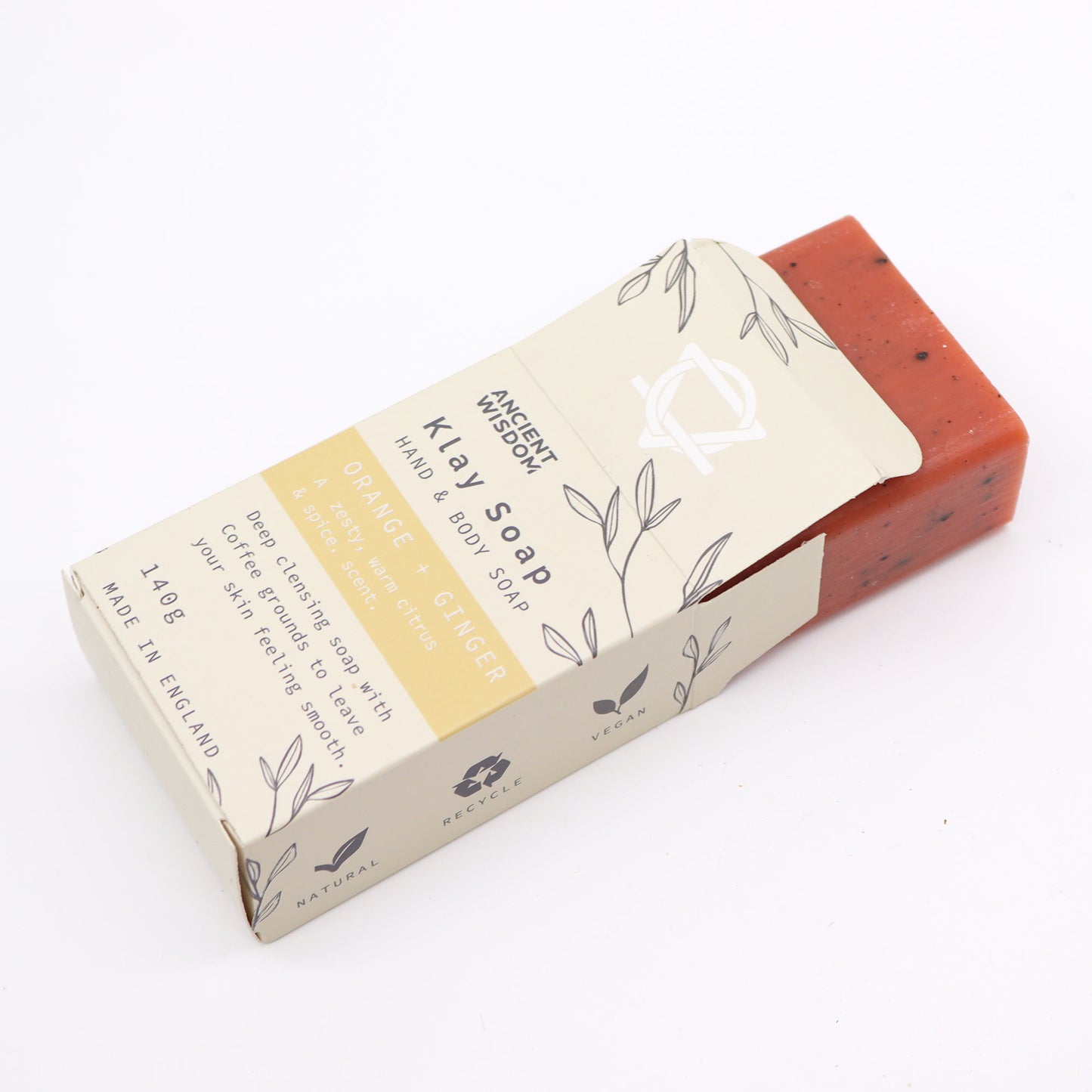 Natural clay soap bar with orange, ginger, yellow clay, and coffee – exfoliating and energising skincare.