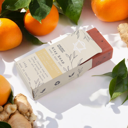 Natural clay soap bar with orange, ginger, yellow clay, and coffee – exfoliating and energising skincare.