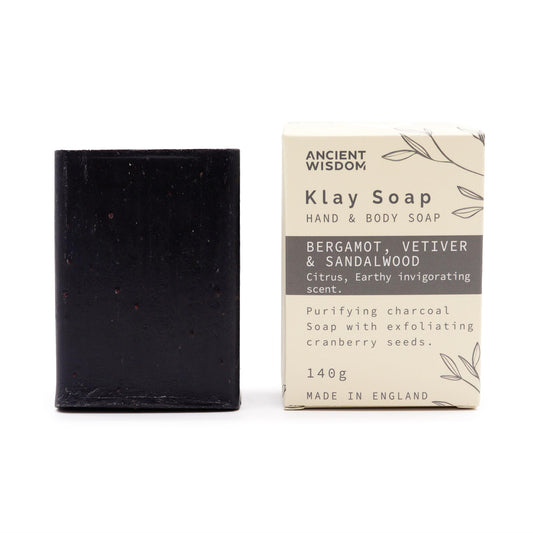Natural clay soap bar with charcoal, cranberry seeds & sandalwood – detoxifying, exfoliating, and handmade in the UK.