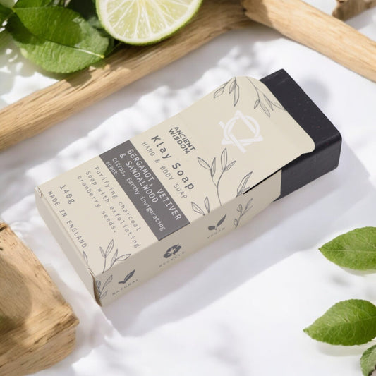 Natural clay soap bar with charcoal, cranberry seeds & sandalwood – detoxifying, exfoliating, and handmade in the UK.