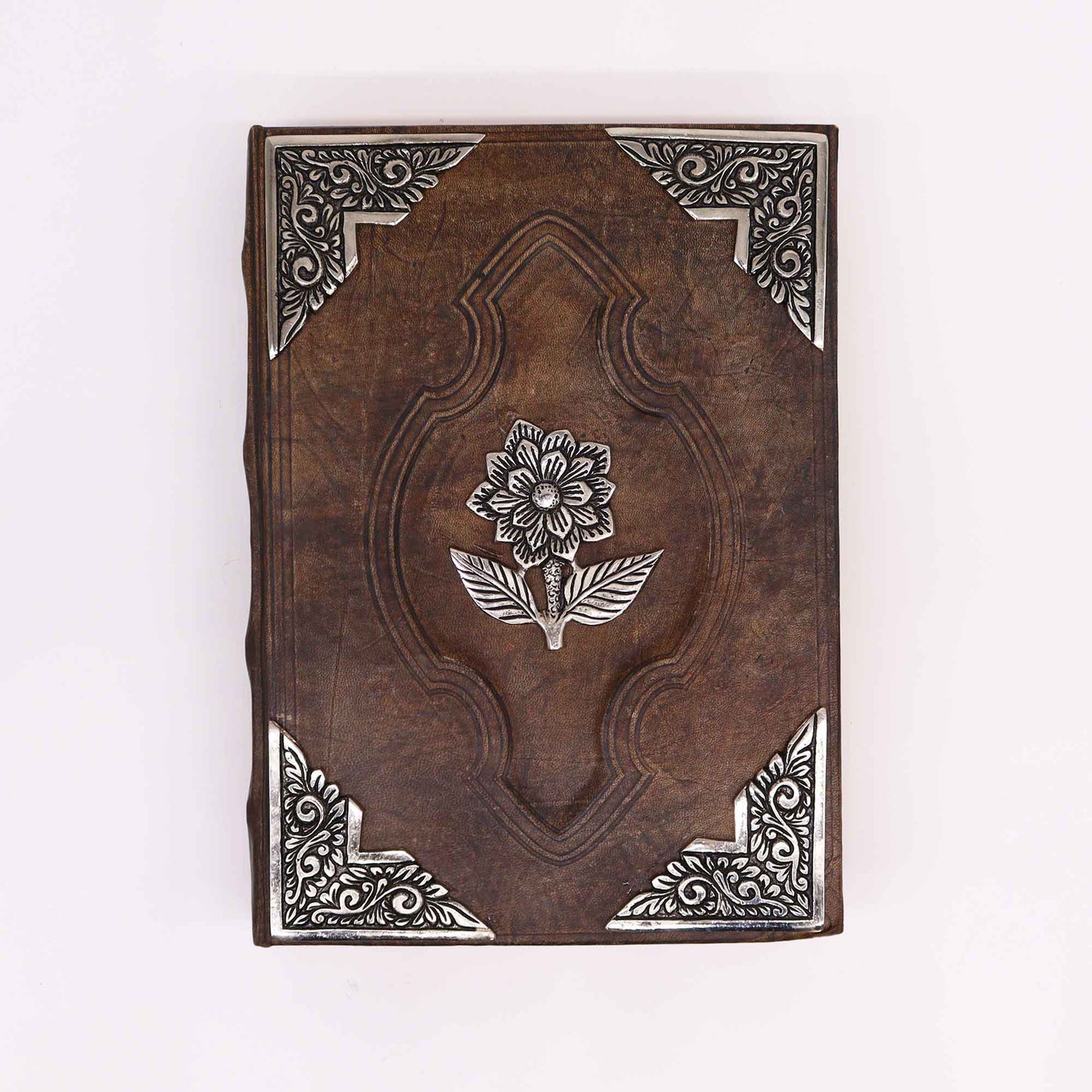 Leatherbound journal with zinc rose emblem and ornate metal corner designs