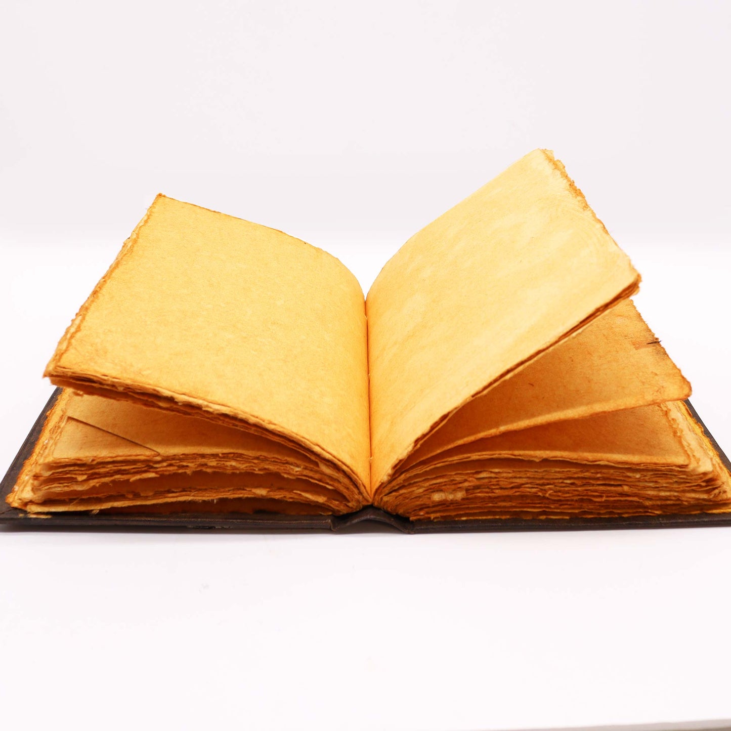 Leatherbound journal with triple moon zinc symbol and embossed corners – 200 deckle-edge pages.