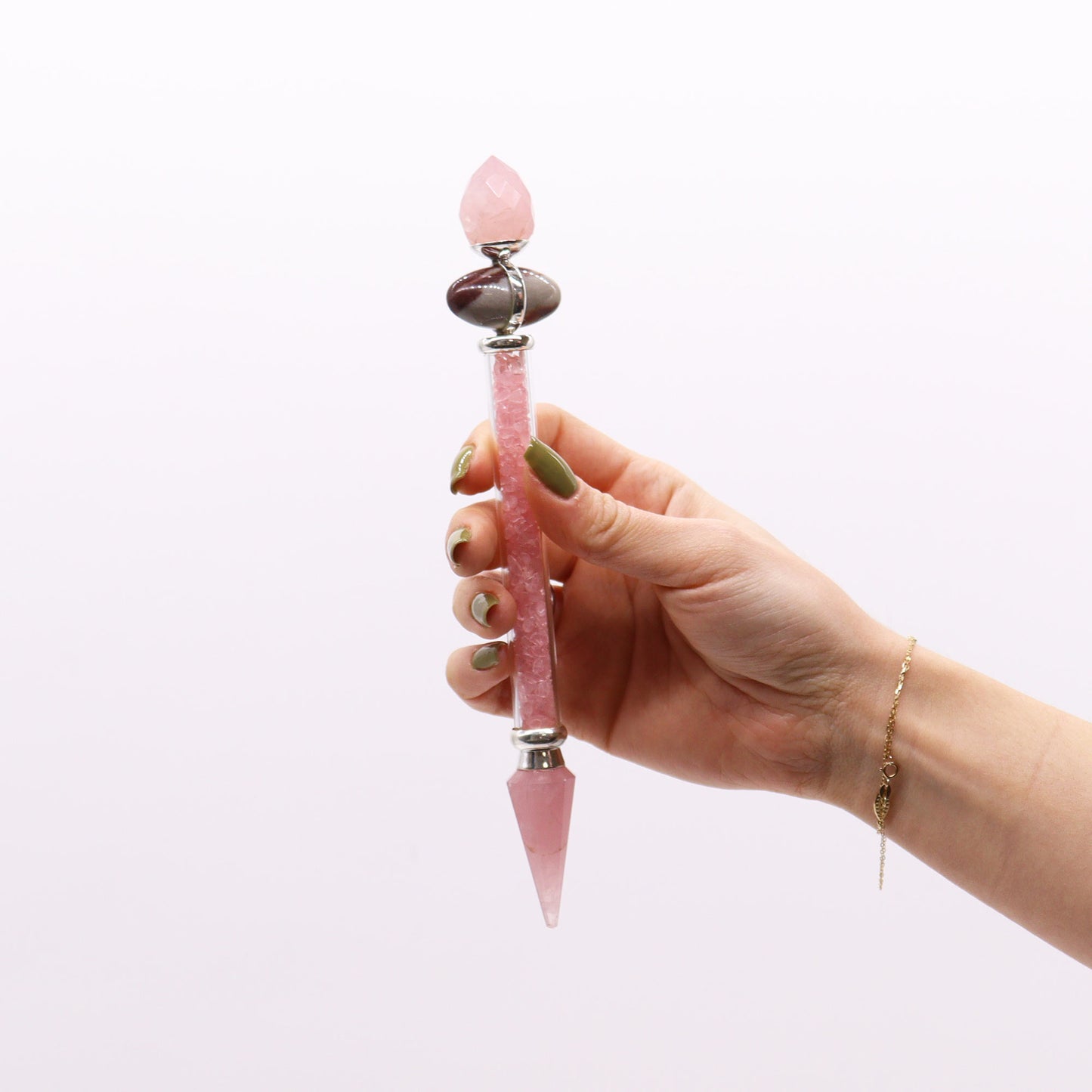 Rose Quartz Shiva Lingam wand filled with soft pink gemstone chips and crystal points. Supports heart chakra, compassion, and gentle emotional healing.