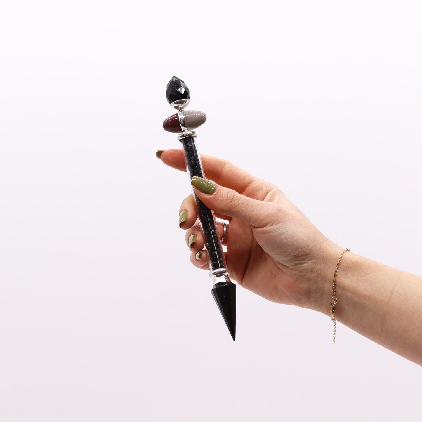 Shiva Lingam wand filled with black tourmaline and agate chips, paired with crystal ends and sacred stones. Perfect for grounding and energy protection.