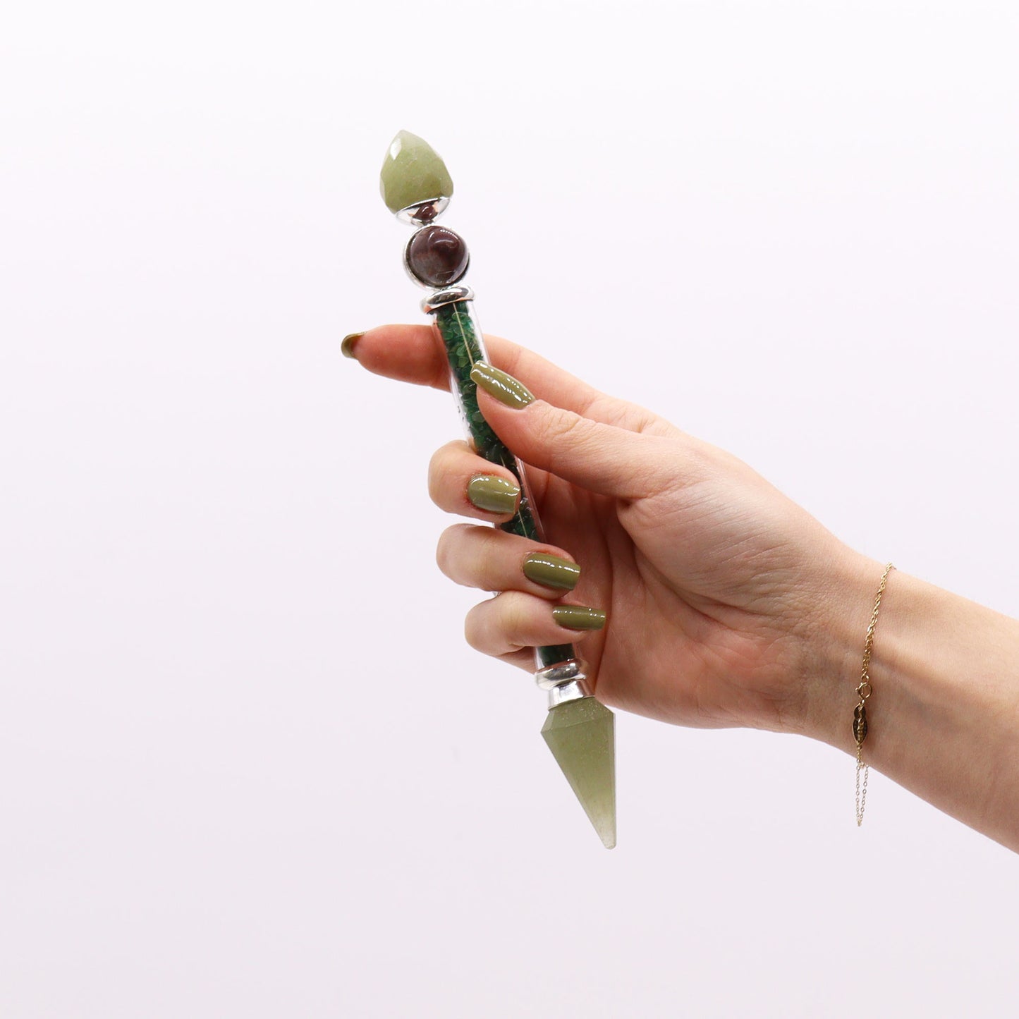 Shiva Lingam wand with green aventurine chips, crystal points, and polished Shiva Lingam stones. Ideal for heart chakra healing and energy work.
