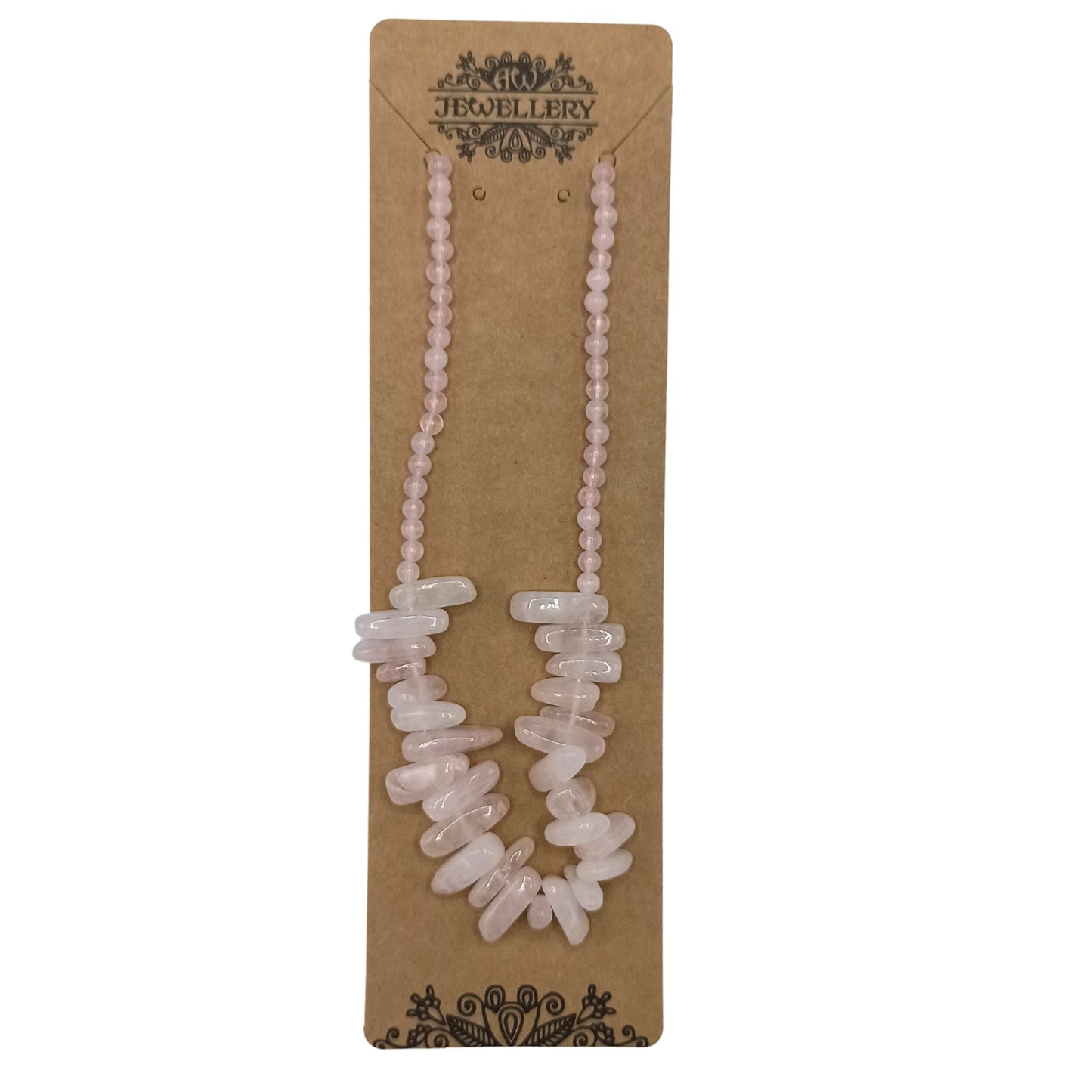 "Longstone Gem Necklace with rose quartz gemstone chips and round beads in soft blushing pink, displayed on a brown card."