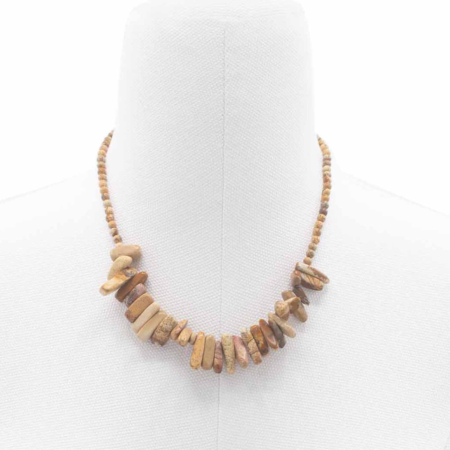 "Longstone Gem Necklace with Map Stone gemstone chips and round beads featuring earthy brown and tan markings, styled on a white display stand."