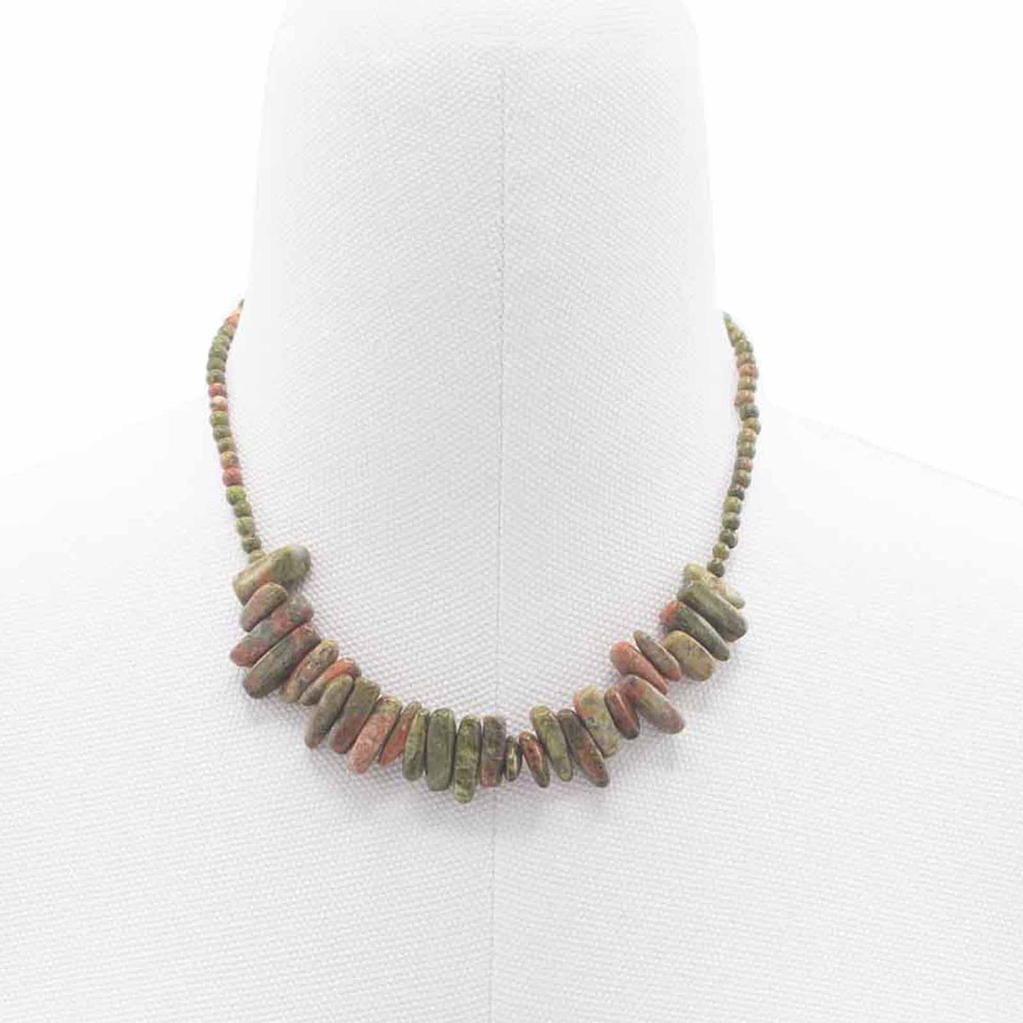 "Longstone Gem Necklace featuring natural unakite gemstone chips and matching round beads in green and pink tones, displayed on a jewellery bust."