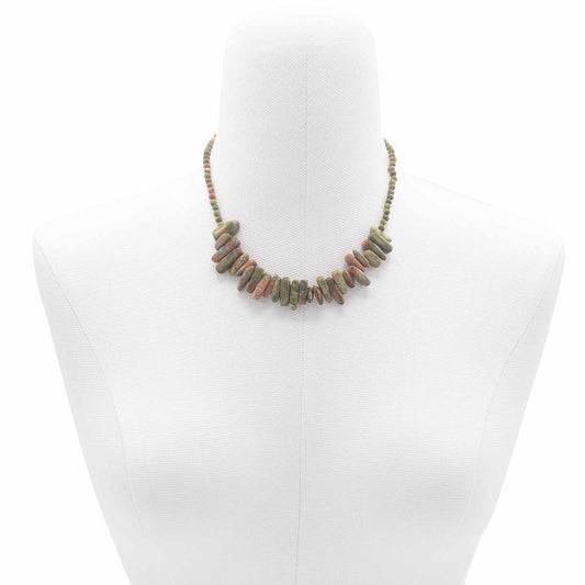 "Longstone Gem Necklace featuring natural unakite gemstone chips and matching round beads in green and pink tones, displayed on a jewellery bust."