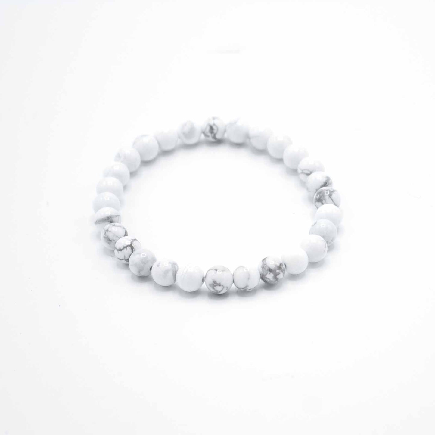 White Jasper gemstone manifestation bracelet with soft white beads, symbolising peace, emotional balance, and calm presence.