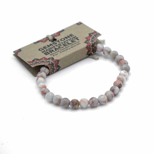 Blood Spider Stone gemstone manifestation bracelet with web-like patterns, symbolising family bonds, unity, and emotional connection.