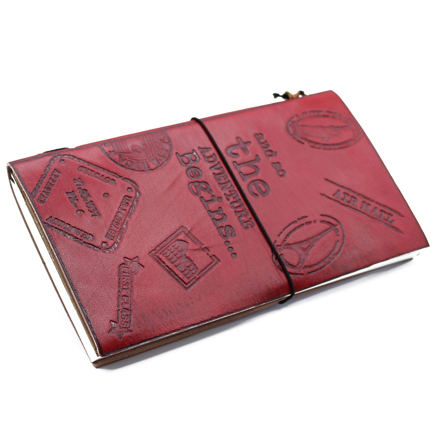 Red leather journal embossed with 'The Adventure Begins' and travel-themed stamps