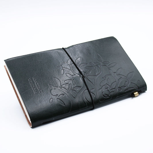 Tree of Life Handmade Leather Journal in Dark Green with embossed design and wrap-around band.