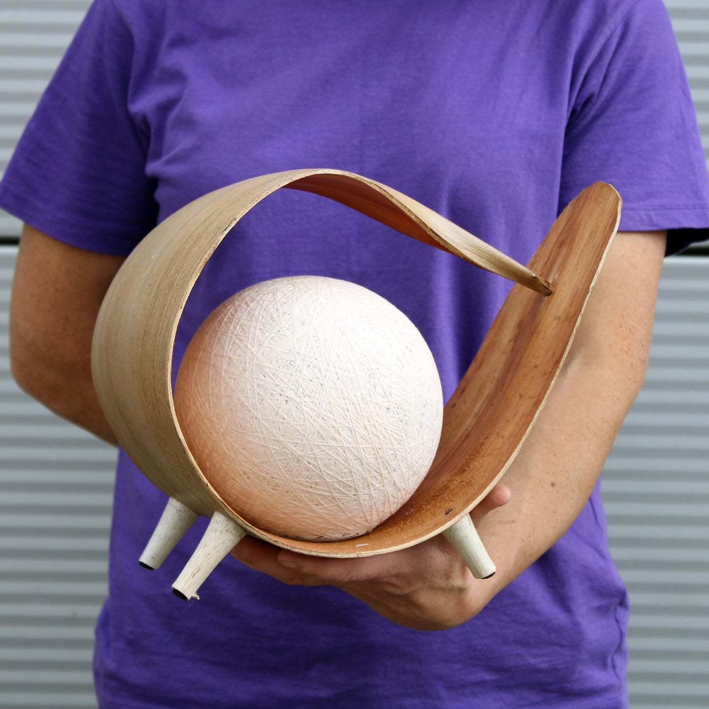 Natural coconut lamp with curved loop shape and cotton twine shade, handcrafted in Bali