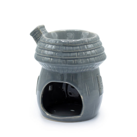 Grey ceramic oil burner shaped like a mushroom house with detailed windows, door, and roof, designed for essential oils and tealights