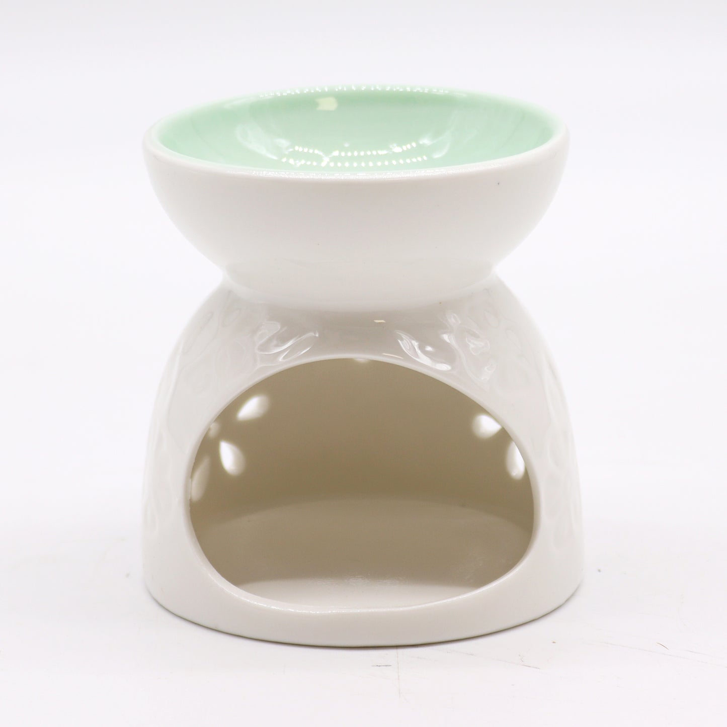 Back view of white ceramic oil burner showing tealight opening and glossy finish