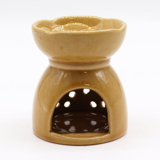 honey-coloured ceramic oil burner with tealight holder and decorative cutouts