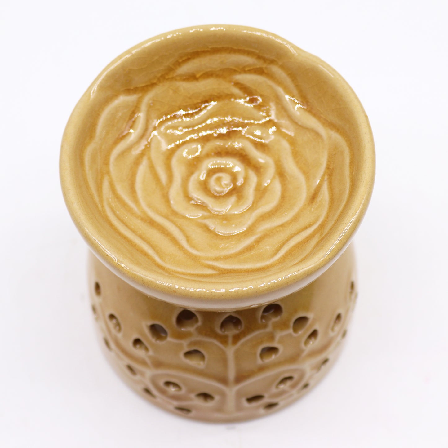 honey-coloured ceramic oil burner with tealight holder and decorative cutouts