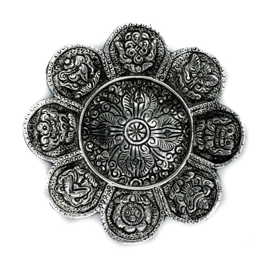 Round polished aluminium incense holder with Tibetan symbols and floral shape, 12cm in size. Suitable for incense sticks and cone incense.