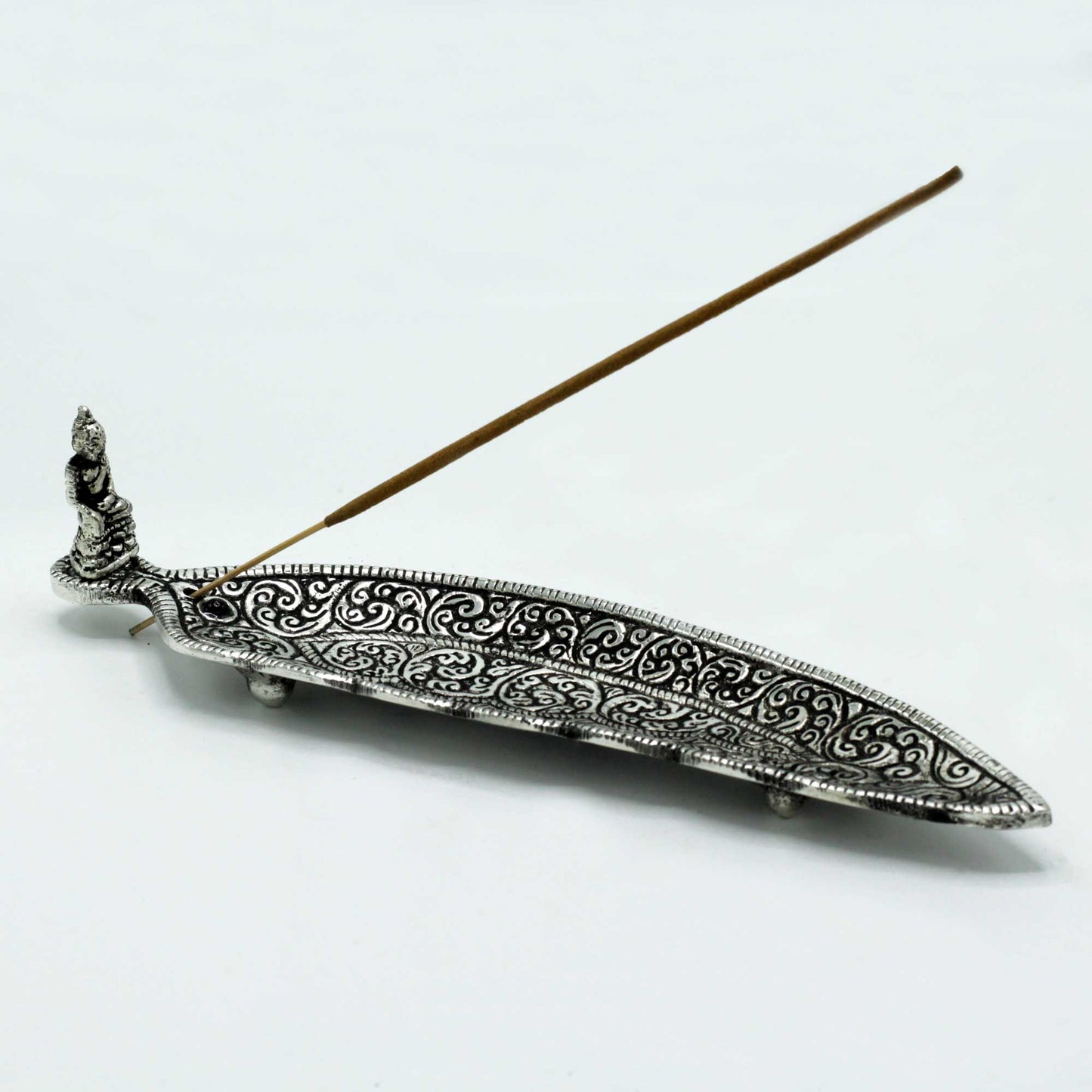 Polished aluminium incense holder with intricate swirl patterns and seated Buddha figurine, ideal for stick incense. 23cm design for peaceful ambience.