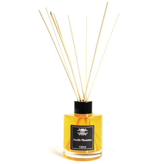 Vanilla Plantation 120ml reed diffuser in clear glass bottle with rattan reeds