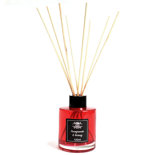 Pomegranate & Nutmeg 120ml reed diffuser in clear bottle with rattan reeds