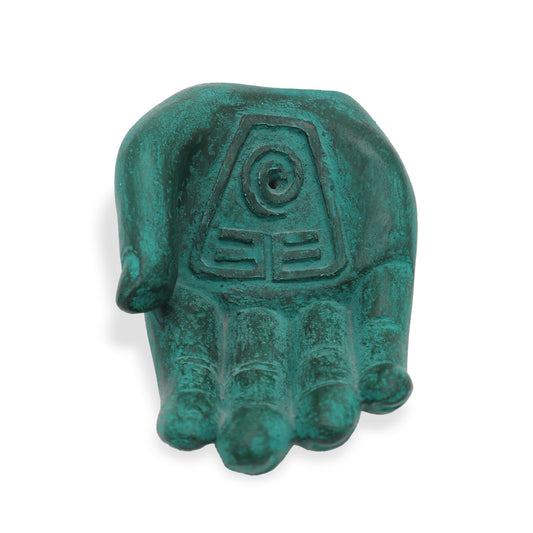 Green stone incense holder shaped like a hand with engraved tribal symbol and “Mother Earth Protection” text.