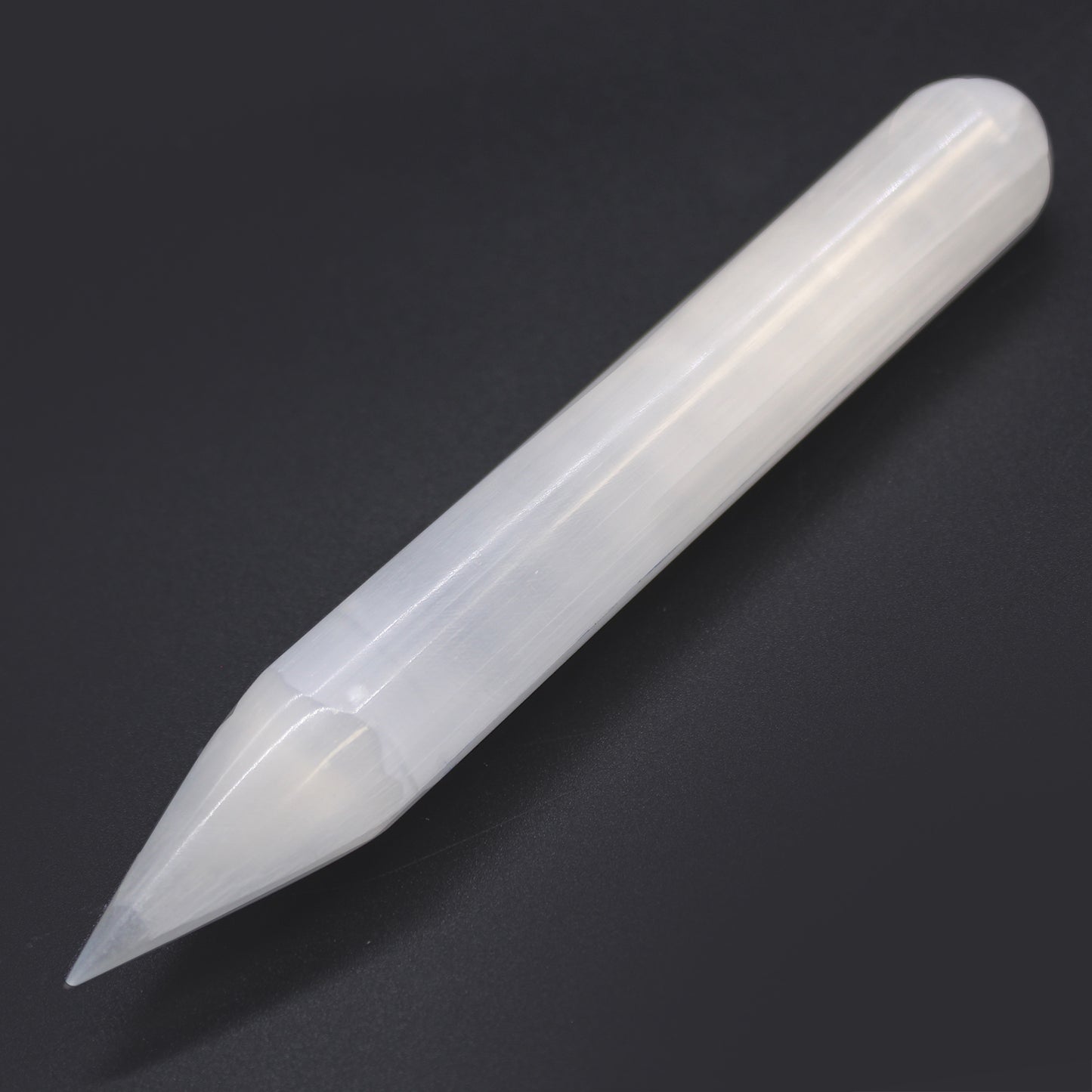 Polished Selenite wand with single pointed tip and rounded base, hand-carved from Moroccan crystal for spiritual cleansing, chakra work, and energy alignment.