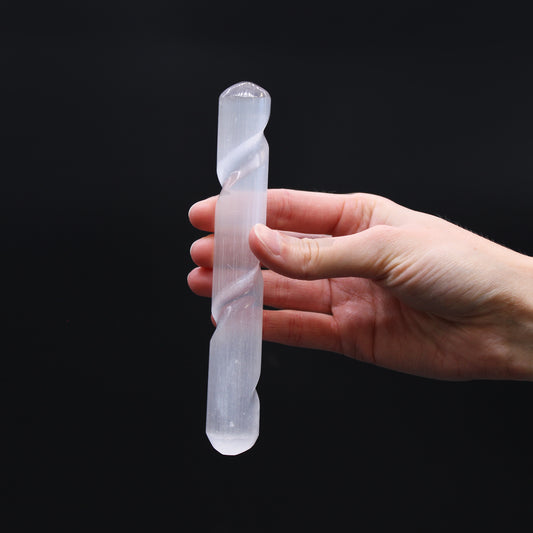 Carved Selenite wand with spiral-grooved body and smooth rounded ends, handcrafted from Moroccan crystal for chakra balancing, aura cleansing, and meditation.