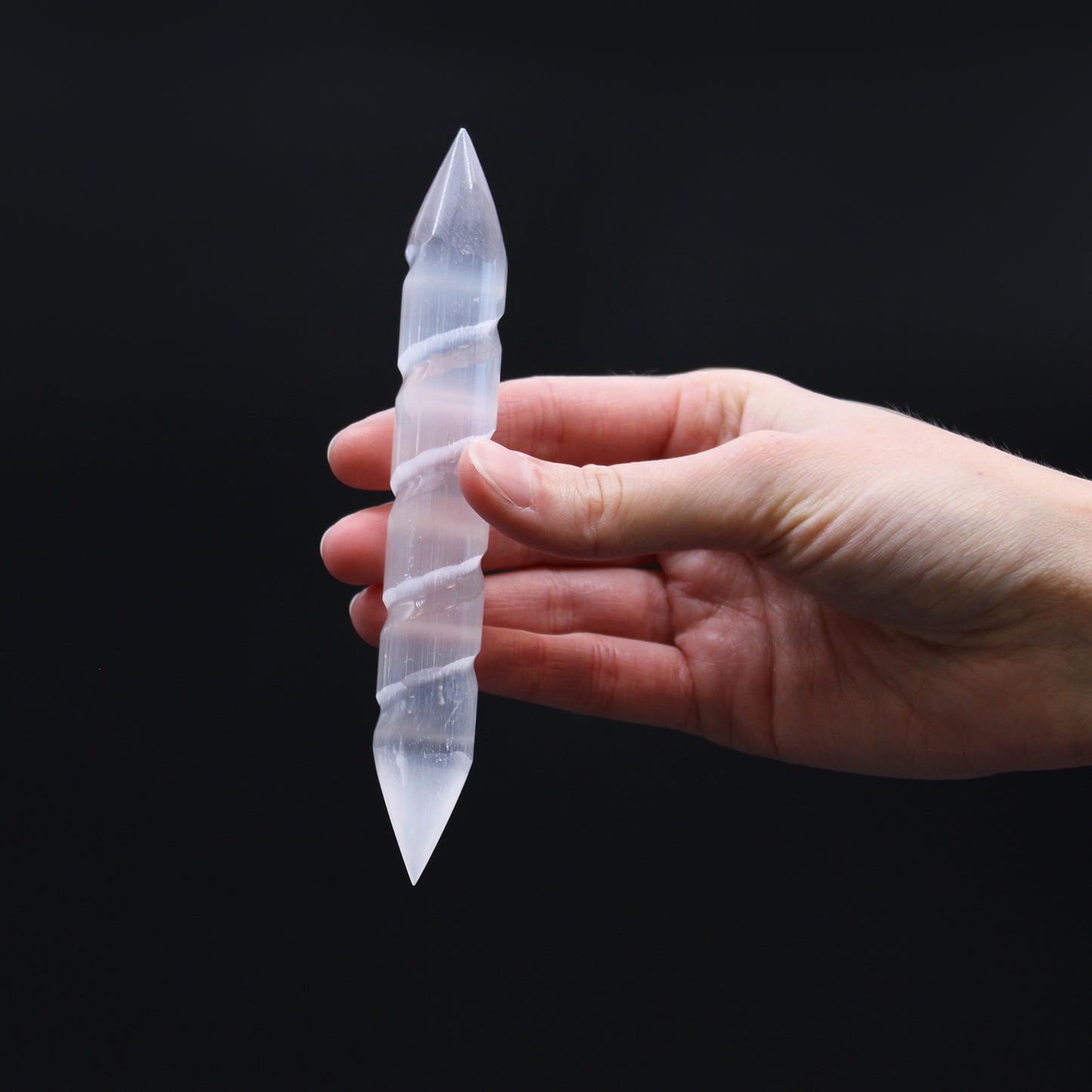 Double-terminated carved Selenite wand with grooved body, hand-cut from Moroccan crystal. Ideal for chakra healing, reiki, and spiritual energy cleansing.