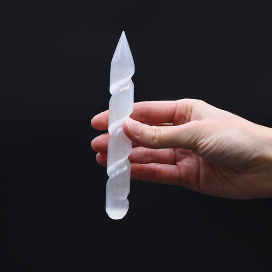 Carved Selenite wand with spiral-grooved body and single pointed tip, hand-cut from Moroccan crystal for energy direction, healing, and spiritual cleansing.