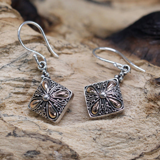 "Square sterling silver earrings with gold teardrop floral accents and scroll detailing, handcrafted in Indonesia."