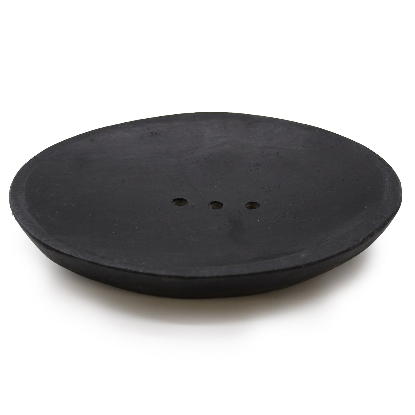 Oval black marble soap dish with drainage holes, handcrafted and minimalist.