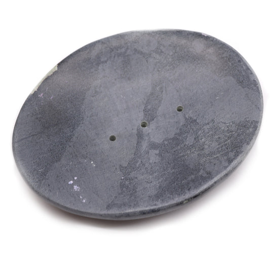 Classic oval grey soapstone soap dish with drainage holes.
