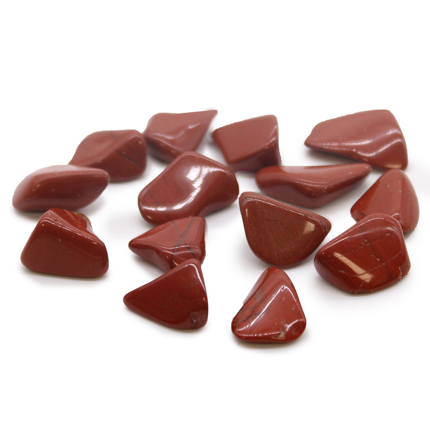 Polished Red Jasper tumbled stones (10–25 mm), known for grounding, strength, and emotional stability. Sold in a 24-piece bag.