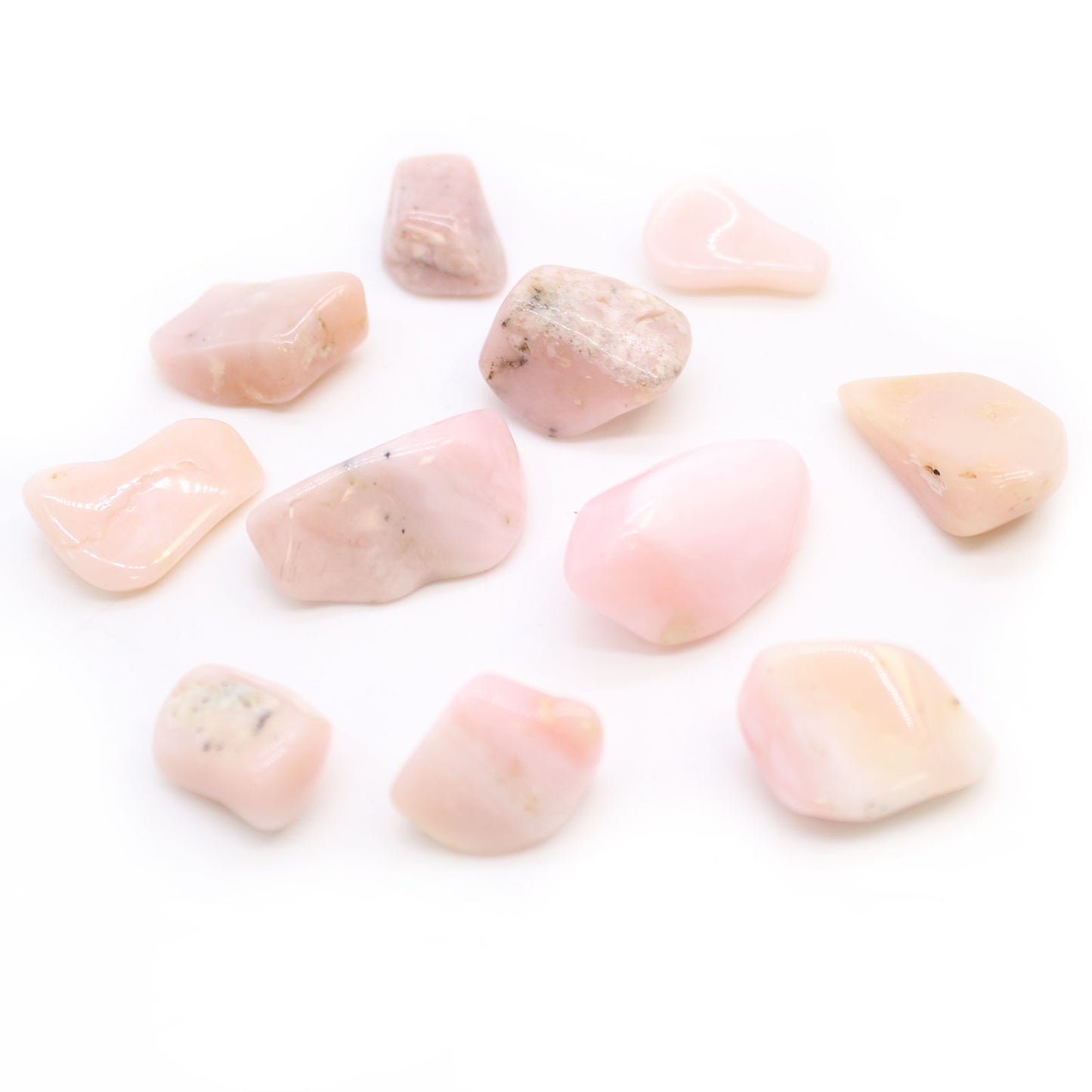 Polished Peruvian Opal tumbled stones (10–25 mm), in soft pastel hues, symbolising emotional healing, inner peace, and heartfelt communication.